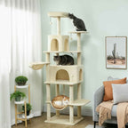 3 cats on large beige cat tree in living room