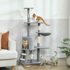 3 cats playing on grey fabric cat tree n living room