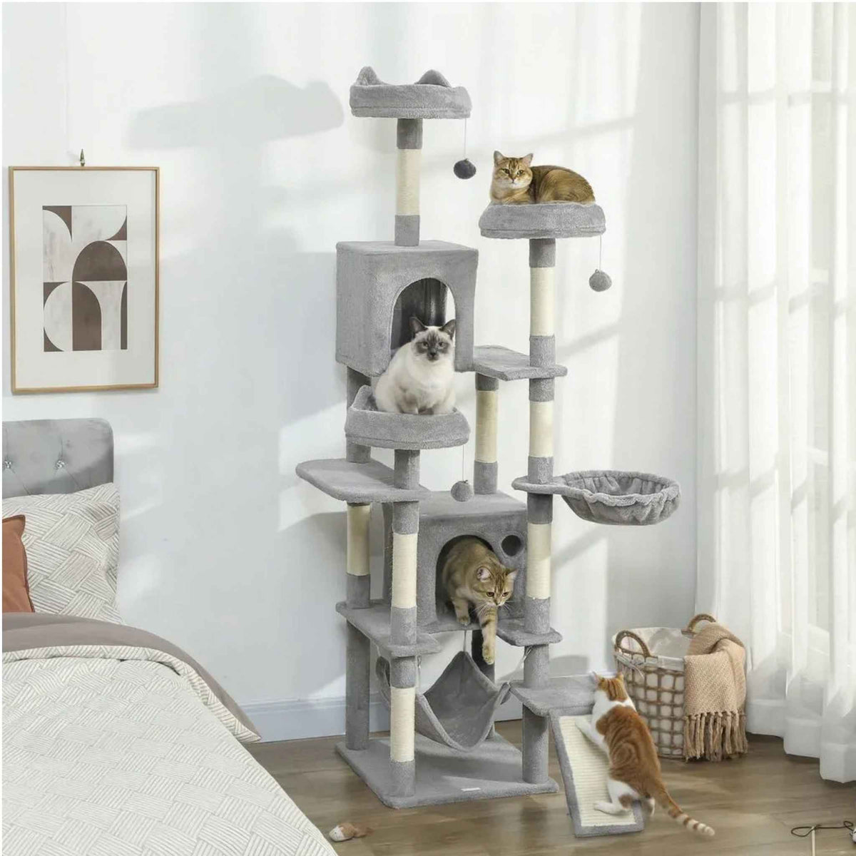 4 cats playing on large grey cat tree