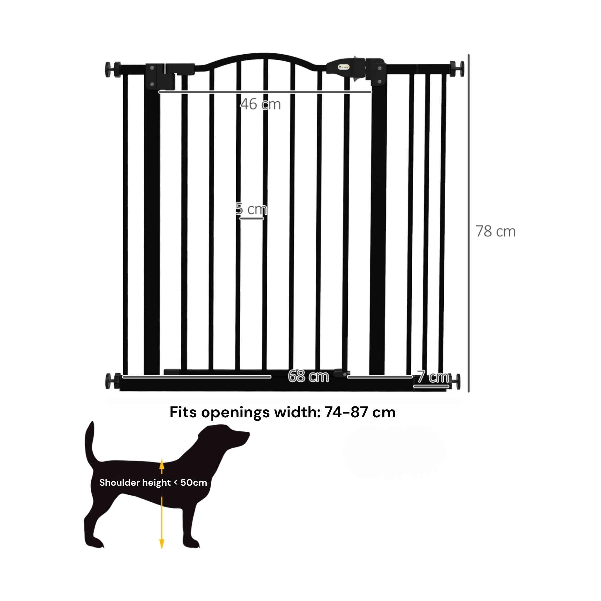Pug standing in front of black dog safety gate