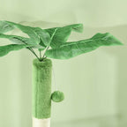 Artificial leaves at the top of green cat tree