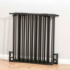 Black dog pen folded and stored against wall