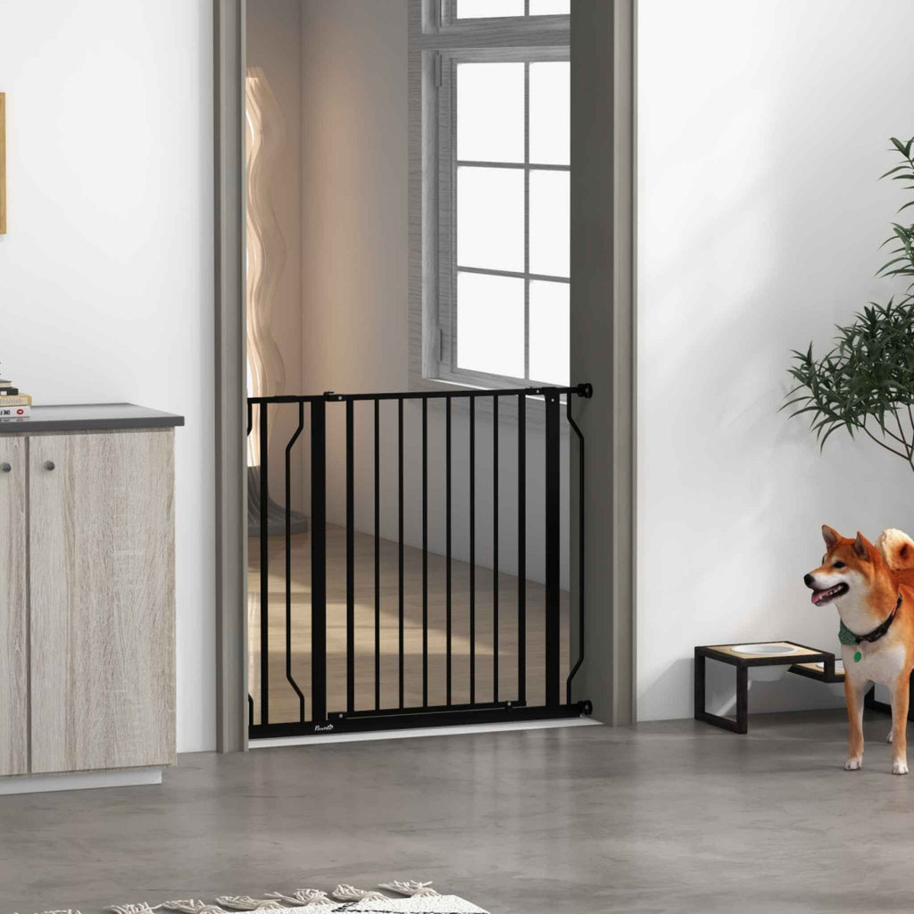 Black pet gate pressure fit in hallway