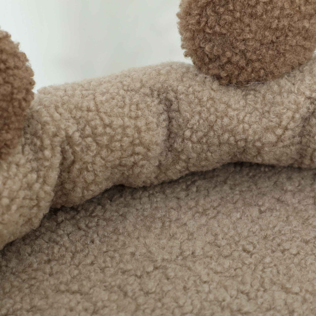 Close-up of a brown cat tree bed