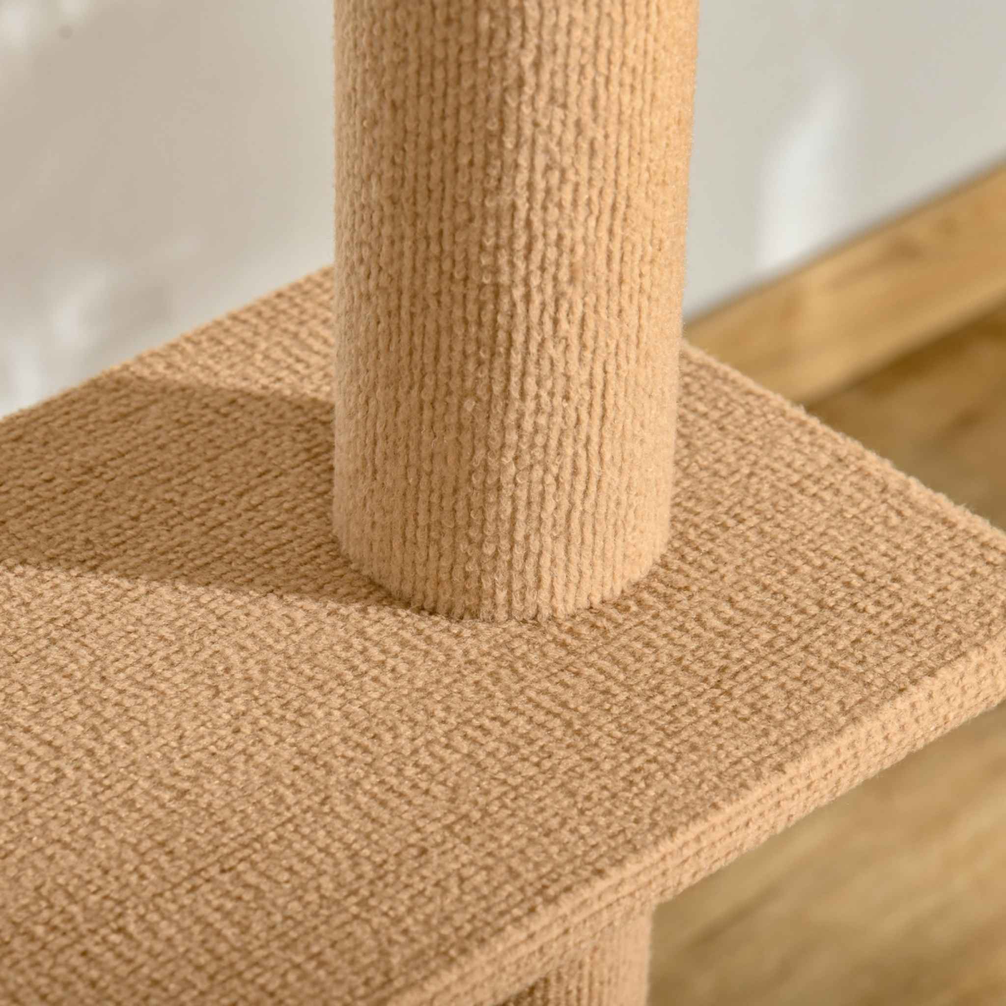 Brown plush fabric on platform of cat tree