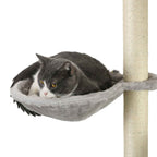 Cat laying in cat tree bed