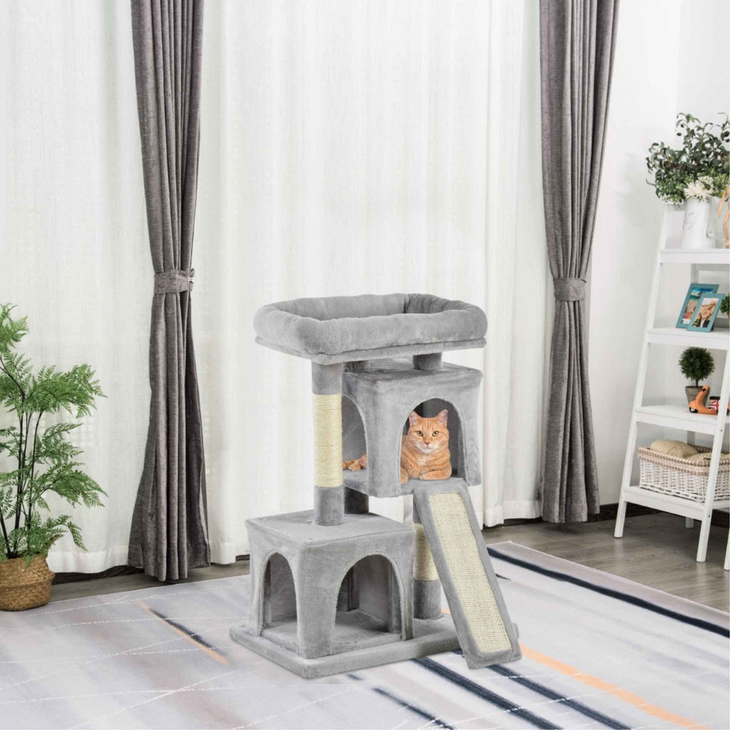 Cat laying in second house in grey cat tree