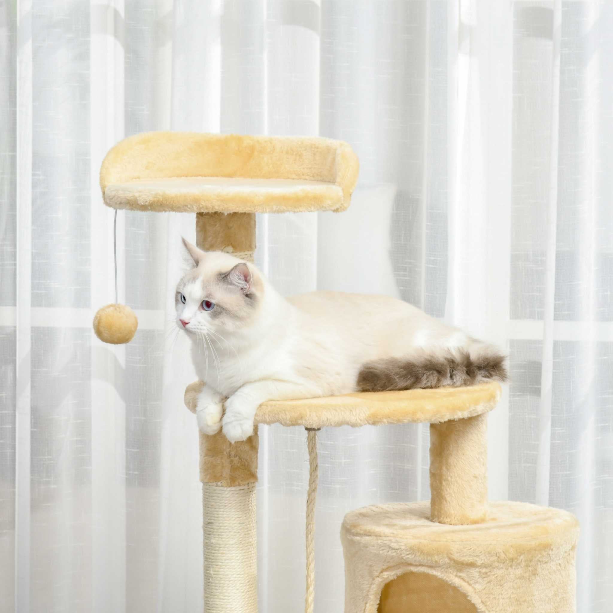 Cat laying on beige cat tree perch