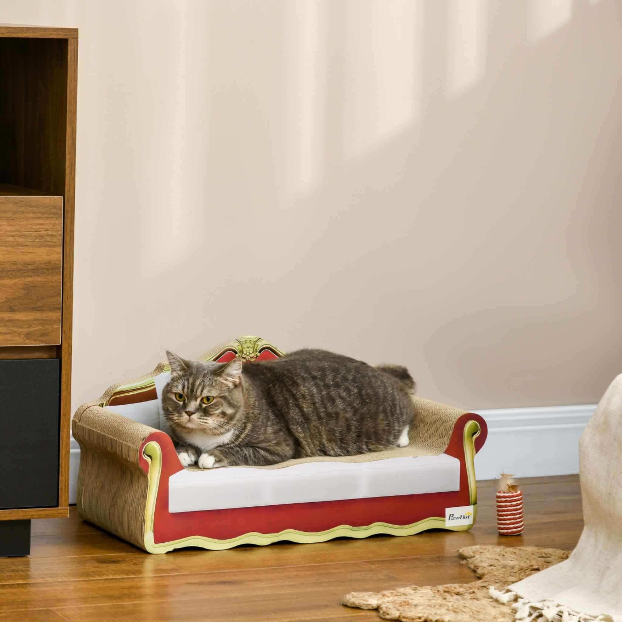 Cat laying on cardboard sofa scratcher