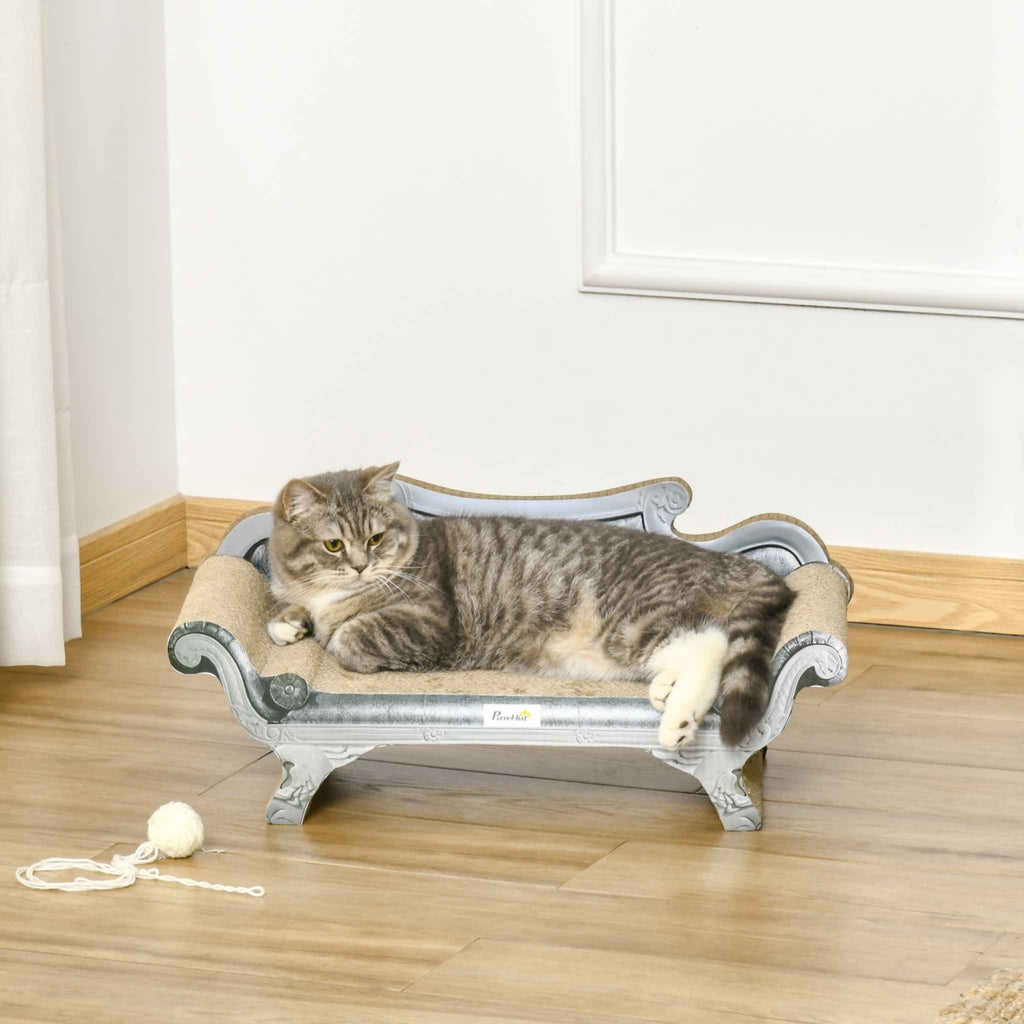 Cat laying on grey cardboard scratcher