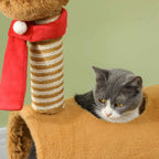 Cat looking at reindeer scratching post