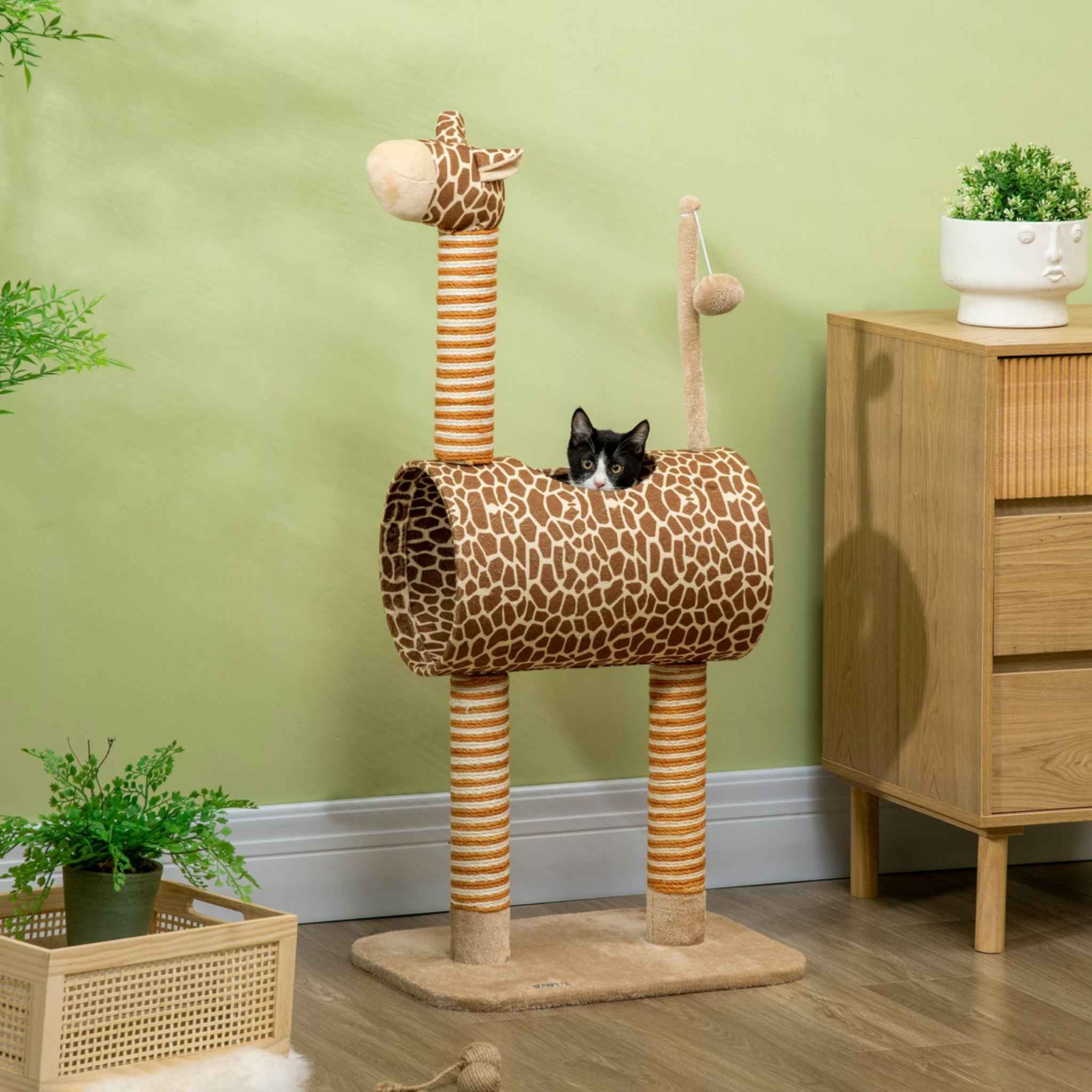 Cat playing in tunnel of giraffe style cat tree