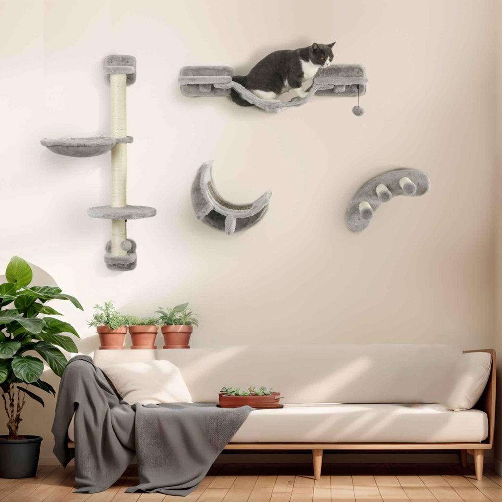 Cat playing on wall mounted cat scratcher in living room