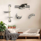 Cat playing on wall mounted cat scratcher in living room