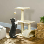 Cat playing with dangling toy on cream cat tree
