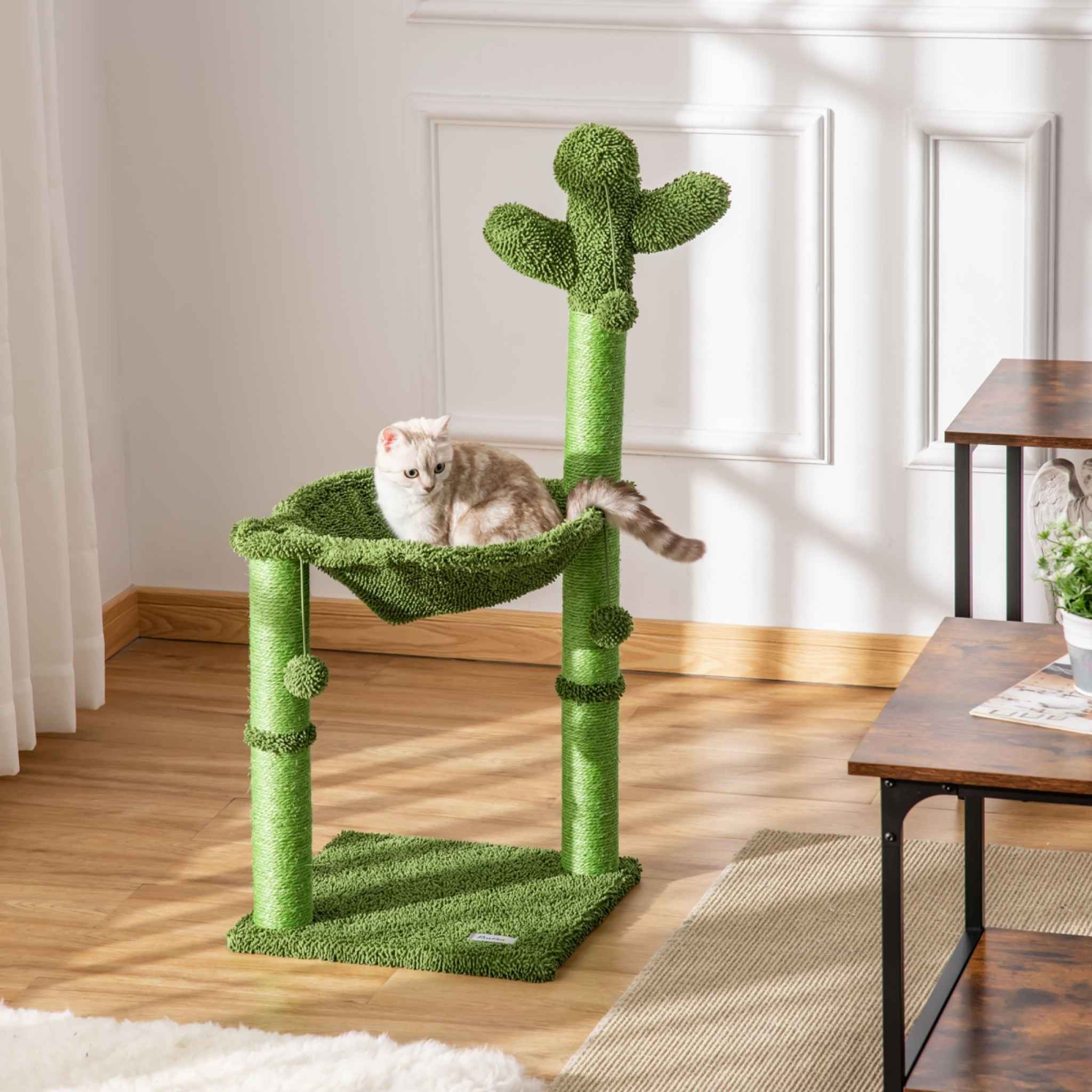 Cat resting on cactus themed cat tree in living room