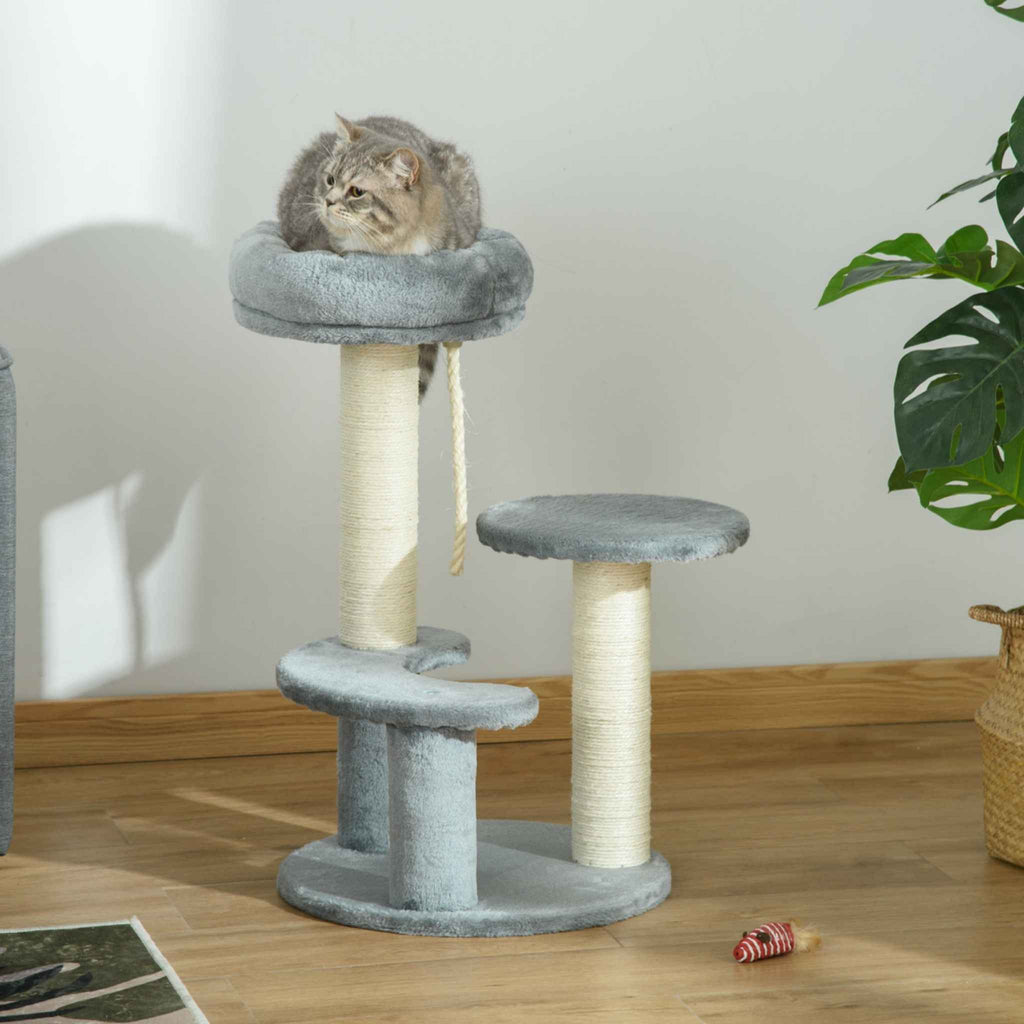 Cat resting on top perch of grey cat tower