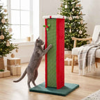 Cat scratching a post in front of Christmas tree