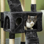 Cat sitting in cat bed attached to extra tall grey cat scratching tree