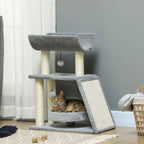 Cat sitting in raised bed within grey cat tower