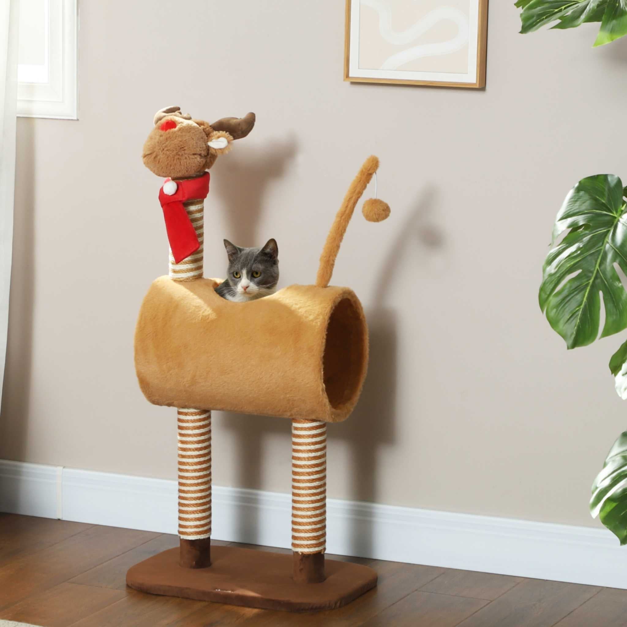 Cat sitting in Xmas themed cat tree