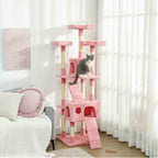 Cat sitting on second level of pink cat tree