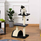 Cat sitting on top level of grey cat tower