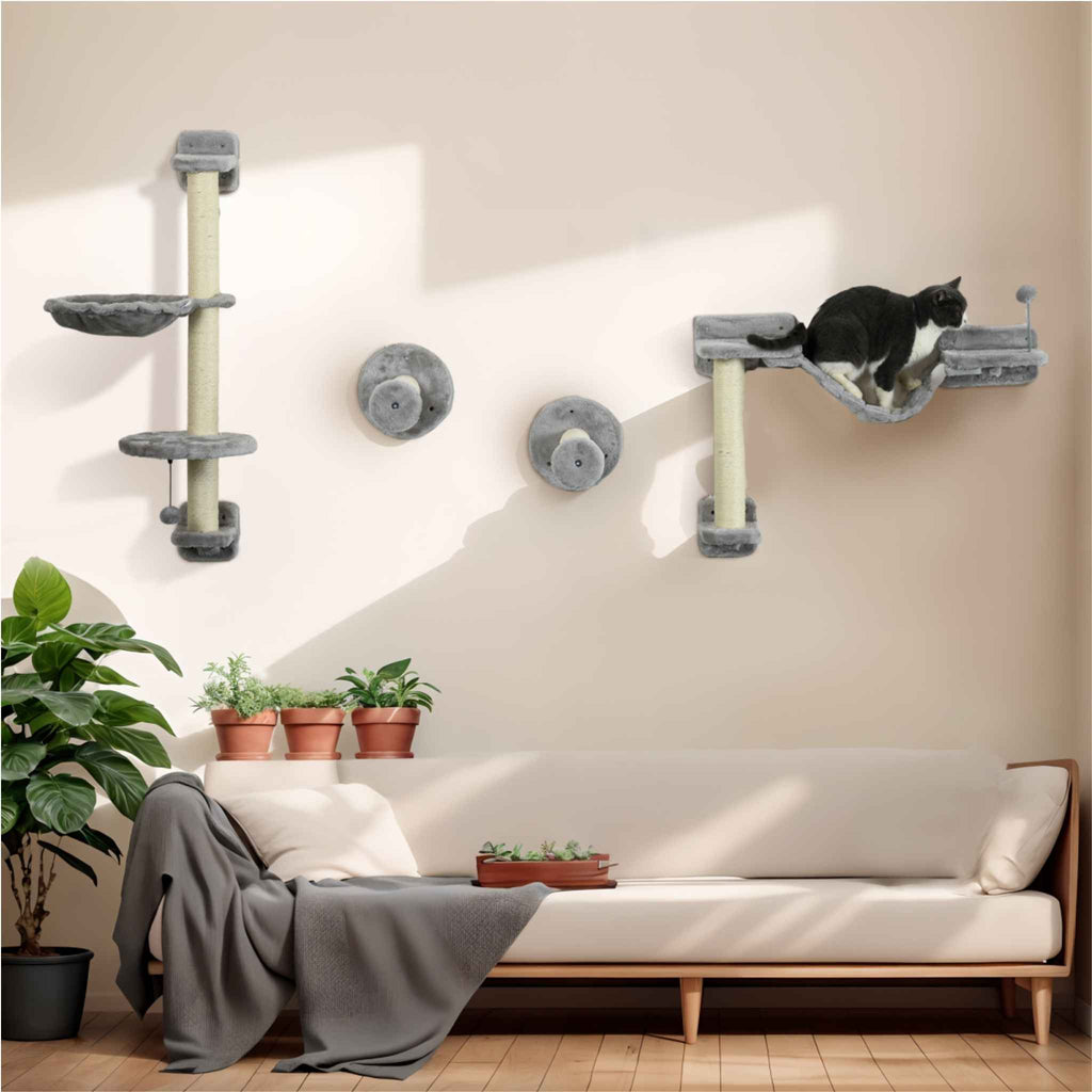 Cat sitting on wall mounted tree in living room