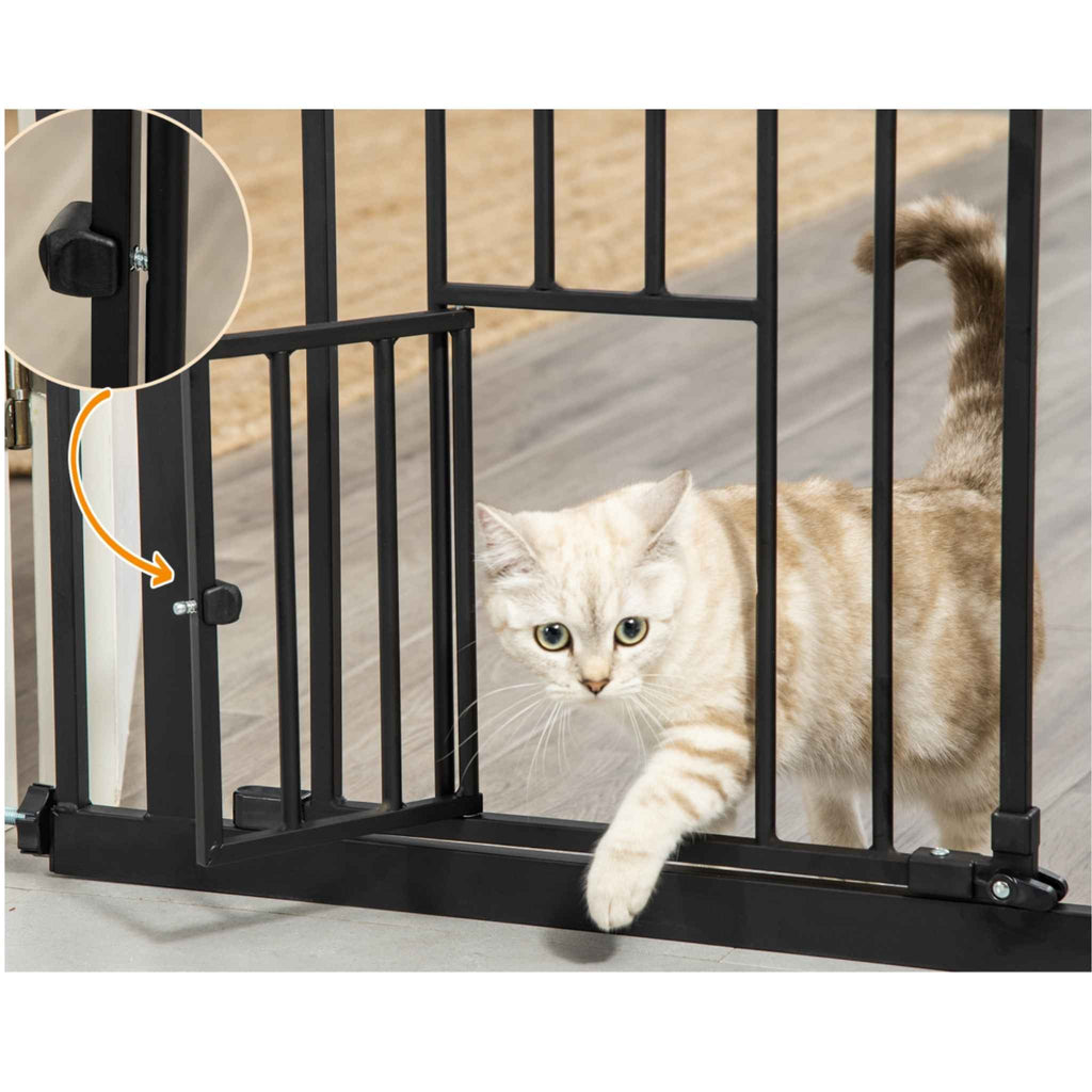 Cat walking through cat door on tall pet gate