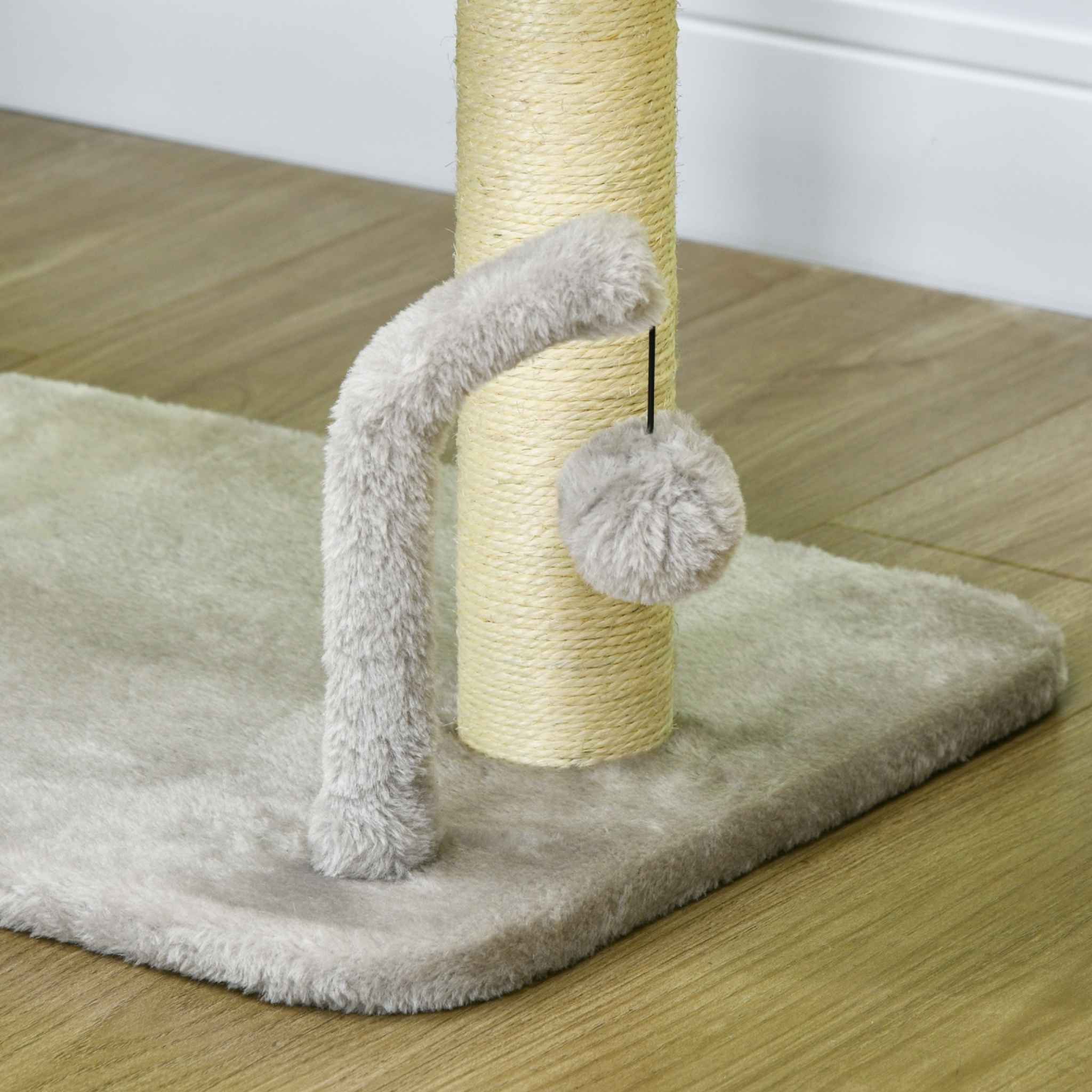 Dangling toy and sisal post on grey cat tree