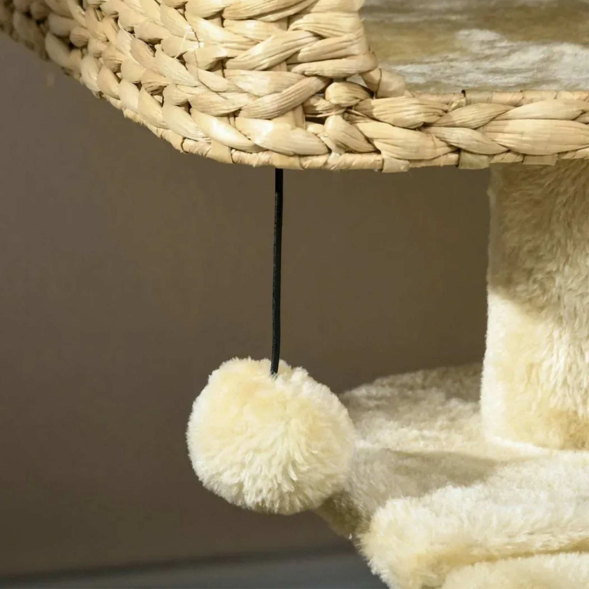 Dangling toy hanging from wicker perch