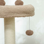 Dangling toy on a brown cat tree
