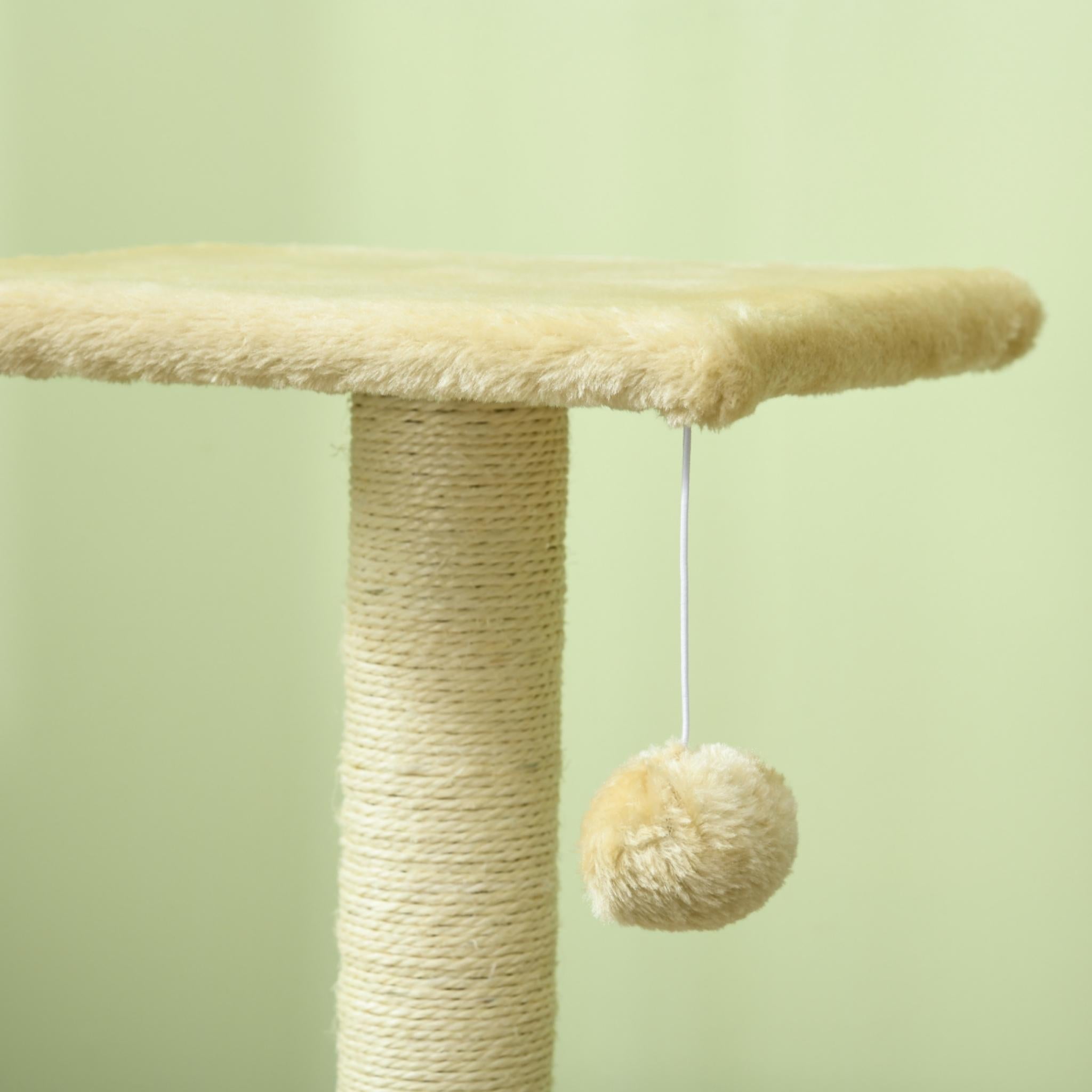 Dangling toy on cream cat tree