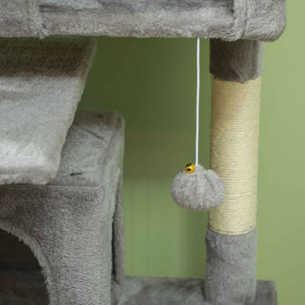 Cat tree with a dangling toy