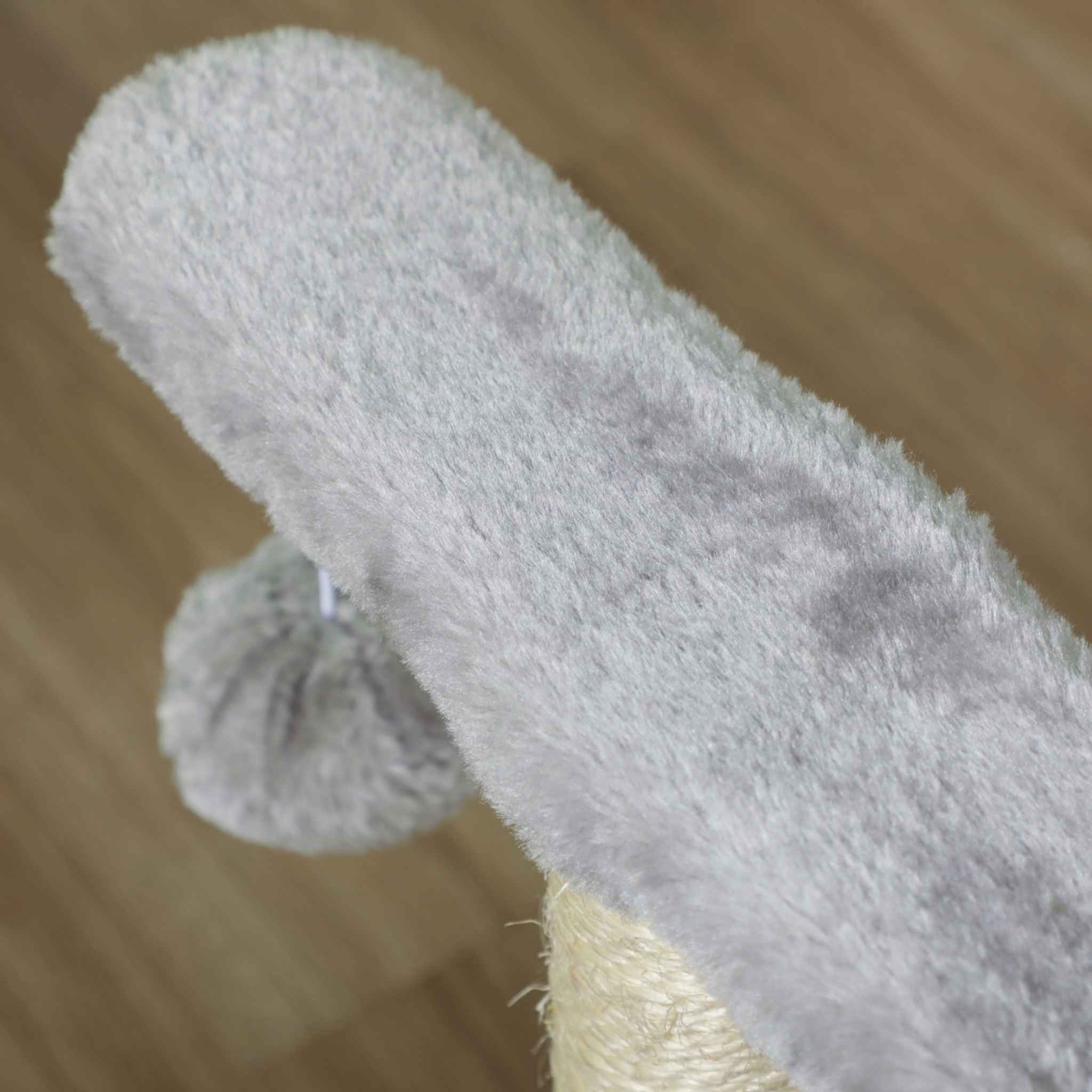 Dangling toy on small grey cat tree