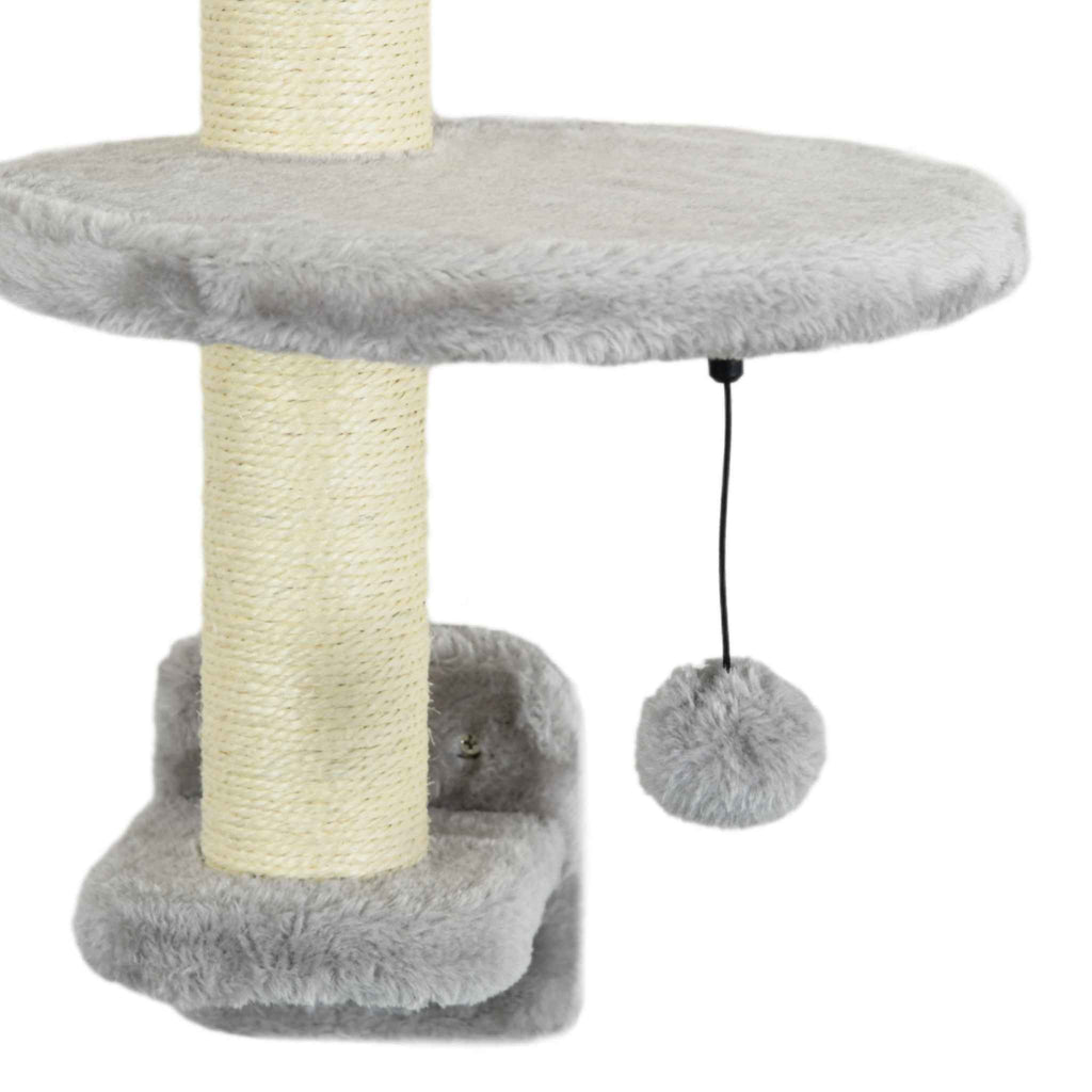 Dangling toy on wall mounted cat scratcher