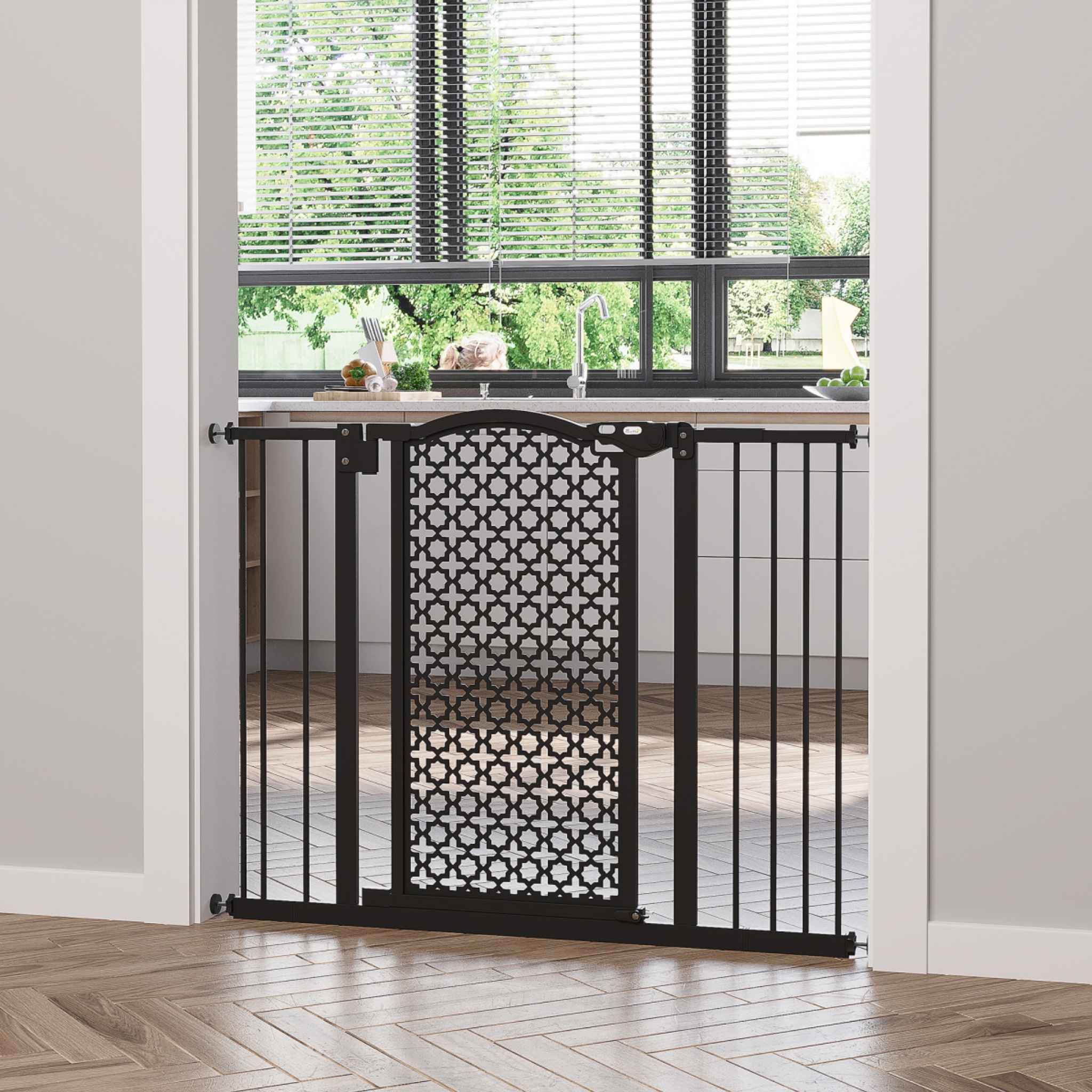 Decorative black dog gate in kitchen doorway
