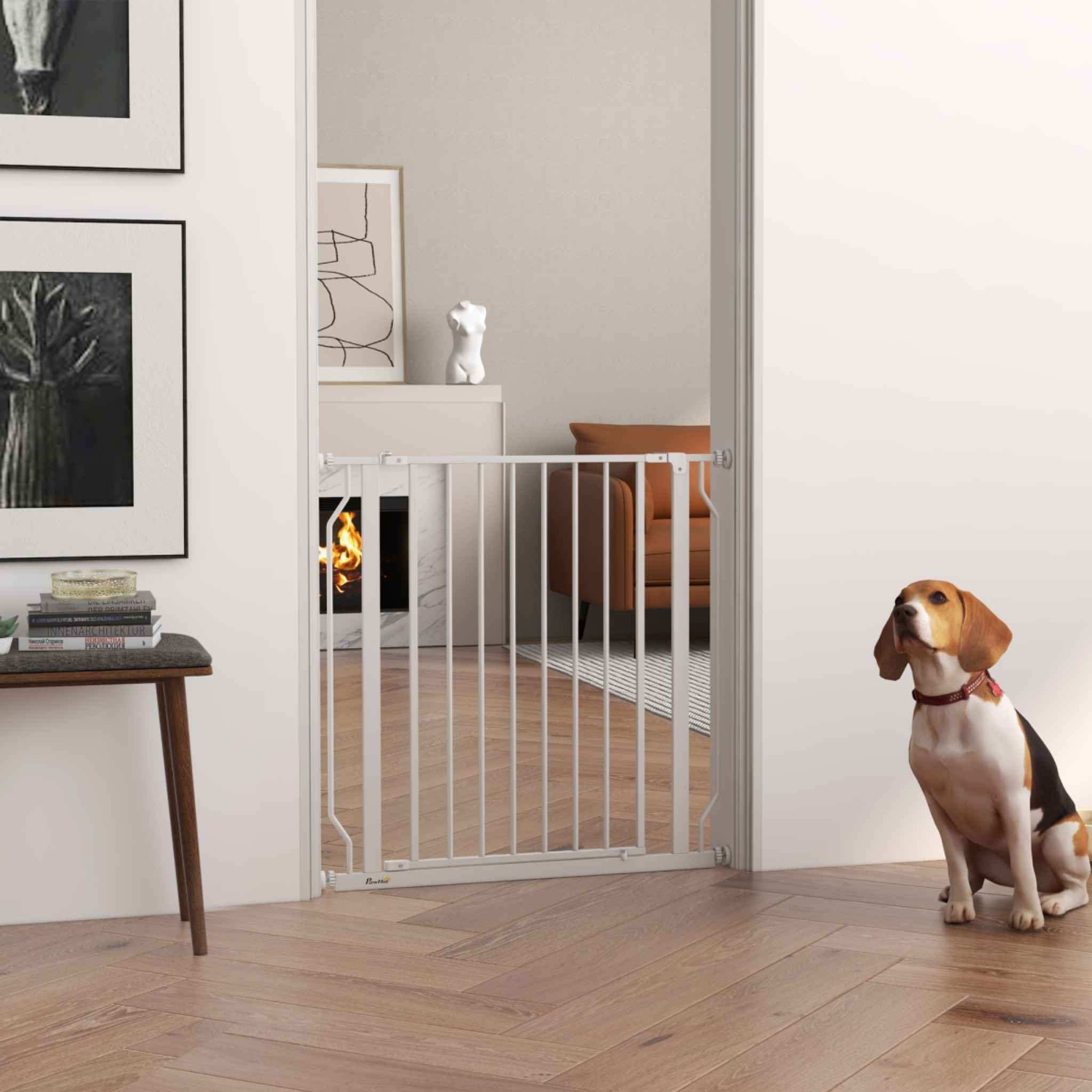 Dog sitting in front of pet barrier pressure fit in living room doorway