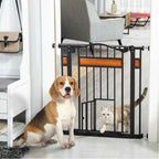 Dog sitting in front of pet gate while cat walks through door