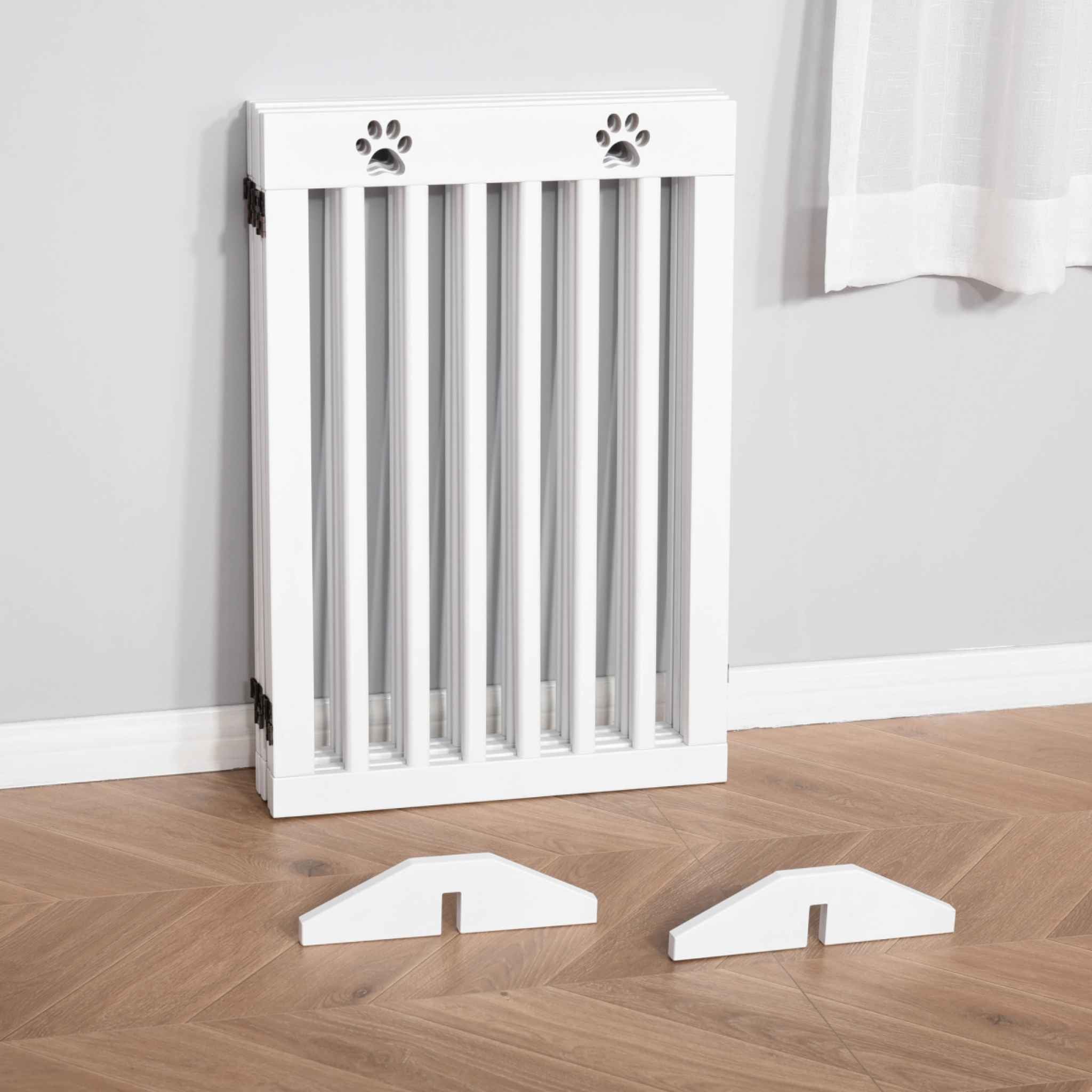 Freestanding white dog gate folded