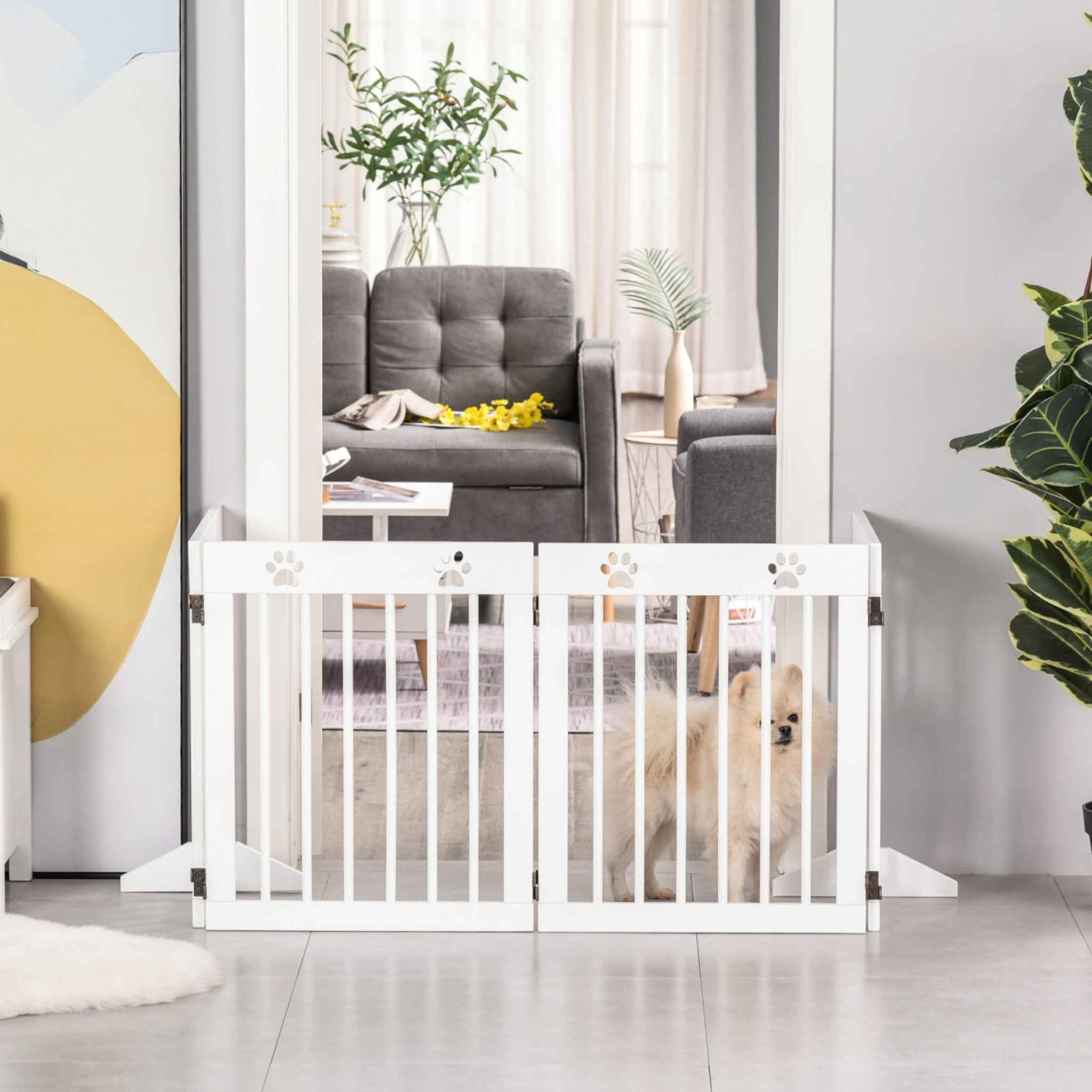 Freestanding white wooden pet gate in doorway