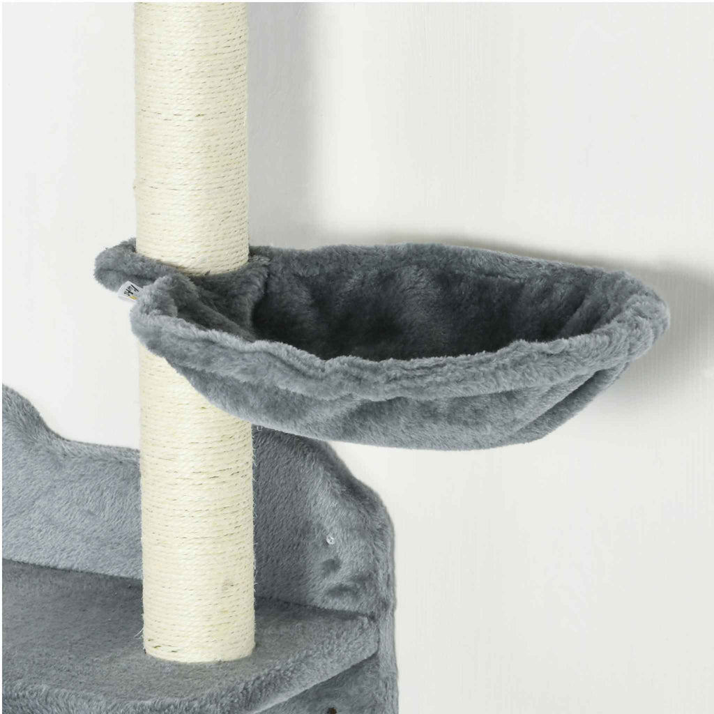 Close-up of a grey plush cat tree perch with a vertical scratching post