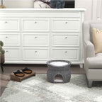 Grey rattan feline bed in living room