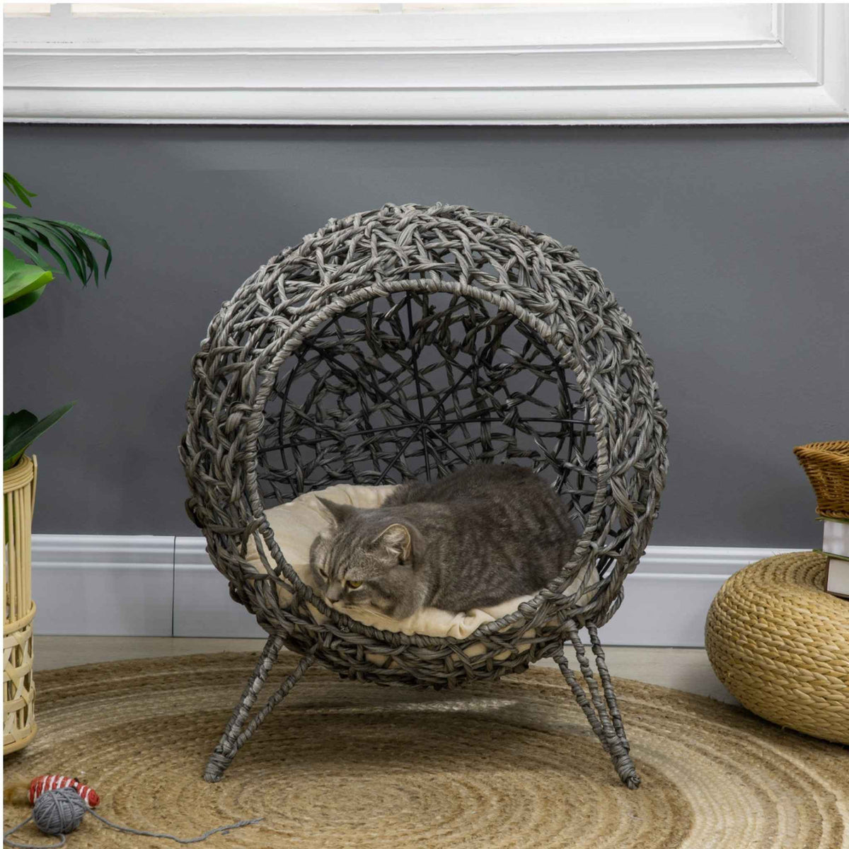 Grey wicker cat bed in living room