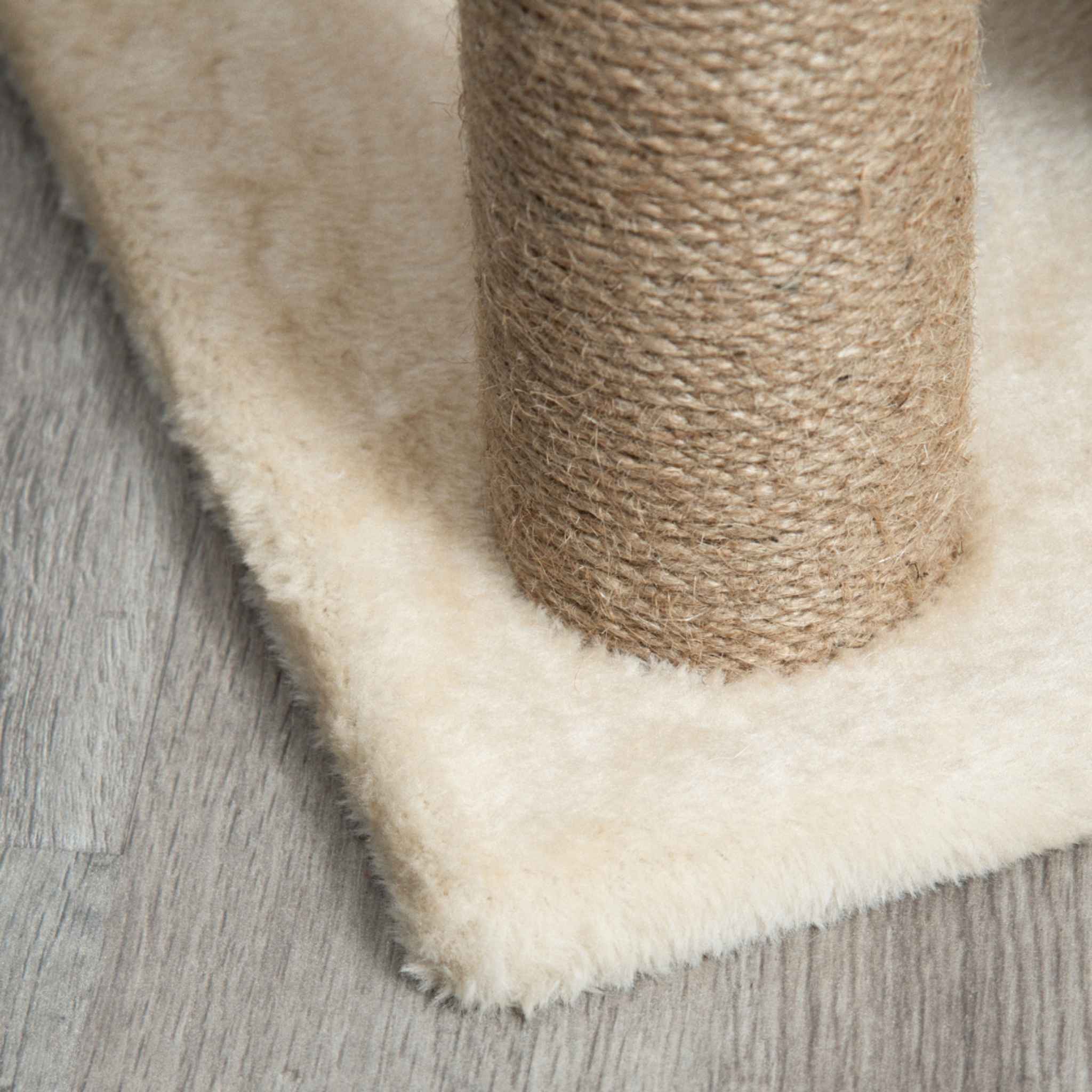 Jute rope scratching post on cream cat tree