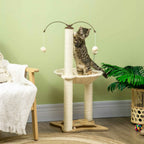 Kitten playing on second level of cream cat tower