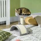 Kitten resting on scratching post platform