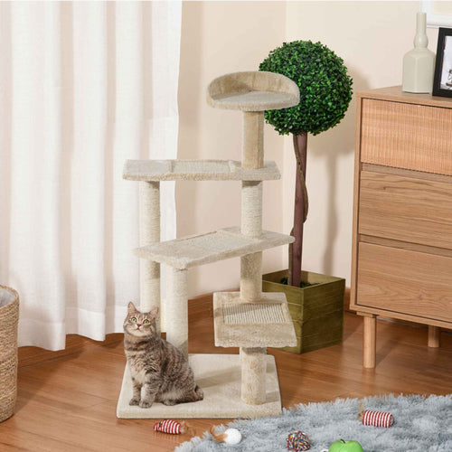 Kitten sitting on beige cat tree tower