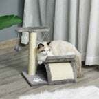 Kitten sitting on small cat tree