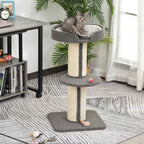 Kitten sitting on top perch of grey cat scratcher post